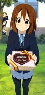 A thrilled Mugi observing Yui handing over a present.