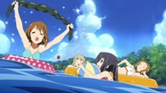 Azusa and the others playing at the beach.