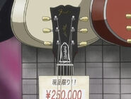 In the original airing, the Gibson Les Paul has a Fender label