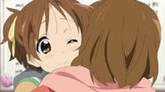Yui congratulates Ui on her acceptance.