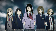 Mio with her friends in their first attire.