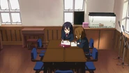 Azusa helps Yui read sheet music.
