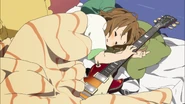 Yui falls asleep with her new guitar