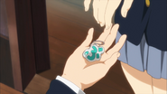 Azusa's keychain is returned to her.