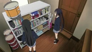Mio and Azusa inside of the club's storage room.