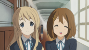 Yui and Mugi encouraging Mio to visit the sick Ritsu.