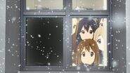 Yui watches the snowfall with the others.