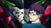 Yusuke Otamaya examining the internals of the Valvrave's face.