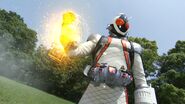 Fourze manifests Rocket Module from his right hand