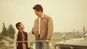 A young Hideo with his father watching the bullet train.