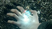 Haruto's tears create the cyan Magic Stone, which transforms into the Infinity Wizard Ring.