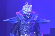 The Ancient King assumes his Greeed form, resembling Eiji's