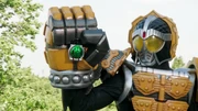 The Suika Lockseed in the grip of Knuckle's Kurumi Bomber