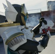KR01-Zein (With Geats Buster QB9 Railgun Mode).png (938 KB) Kamen Rider Zein wielding the Geats Buster QB9 Railgun Mode