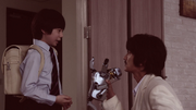 Gai being told by his father to return Thouser