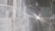 Kiriko trying to separate Hajime Taga and the Sword Roidmude while also protecting Go