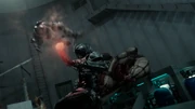 Kamen Rider Black Sun performing an upper-cut punch on Kamen Rider Shadowmoon