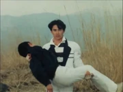 Nobuhiko, untransformed, dies in Kotaro's arms