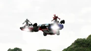 Drive and Mach standing on the Booster Tridoron in Type Wild