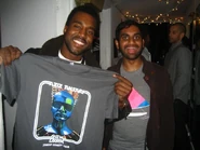 Kanye West photographed with Indian-American actor Aziz Ansari at a Glow in the Dark (tour) show (Largo, Los Angeles), done by Mb3741 (Wikimedia Commons).