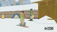 Riding a snowboard.