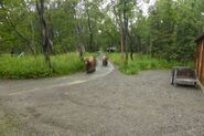 130 Tundra (far) with 89 Backpack (near) June 17, 2014 walking through Brooks Camp outside the Visitor Center. NPS photo