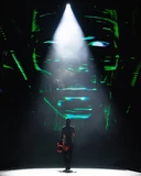 Katy battling Mainframe while singing "Rise".