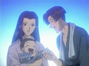 The Arai family smiling together
