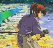 Kenji in his teens as he appears in Reflection, in the Battōjutsu stance, preparing to spar 25 year old Myōjin Yahiko.