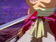 Kenshin being hit in the abdomen by Shishio's stab