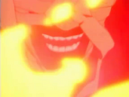 Shishio laughing while his body combusts