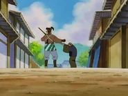 Heizō accepting a money donation from a man on the street