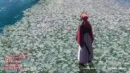 Kenshin walking on the shore of a river