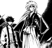 Kenshin and Sano watch on as Yahiko battles