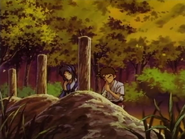 Eiji and Misao praying on Ei'ichirō (and his parents) graves