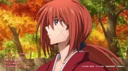 A close-up of Kenshin with trees in the background
