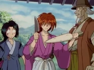 Kenshin showing a vegetable to test the knife