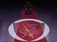 The crest of the Black Knights being shown to the ambassador