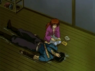 Kenshin treating Hiko from his injuries