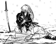 Kenshin holds Tomoe's lifeless body.
