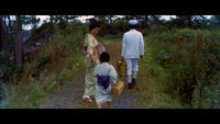 Shiro walking the path of Koichi Village with his parents.