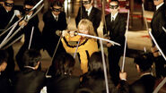 Yakuza encircle Beatrix Kiddo.