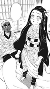 Sakonji sitting with Nezuko.