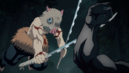 Inosuke trying to cut Father Spider Demon's arm