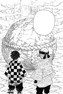 Sakonji tells Tanjiro to split the boulder and prove himself.