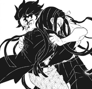 Nezuko desperately holds her brother back.