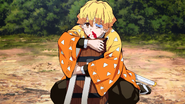 Zenitsu protecting Nezuko from Inosuke