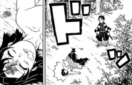 Inosuke collapses from Tanjiro's headbutt.