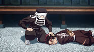 Goto tries to wake Tanjiro up.