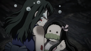 Nezuko is scolded by Suma angrily after she set Tengen on fire.